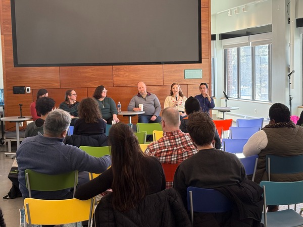 A panel engages with faculty and staff in Wyckoff Center 