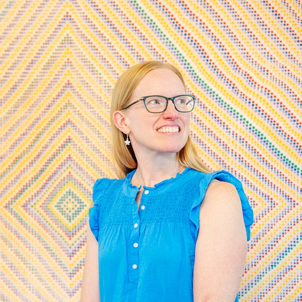 Professor of Mathematics and First-Year Experience (FYE) Director Rachel Roe-Dale smiles while looking off to the side.